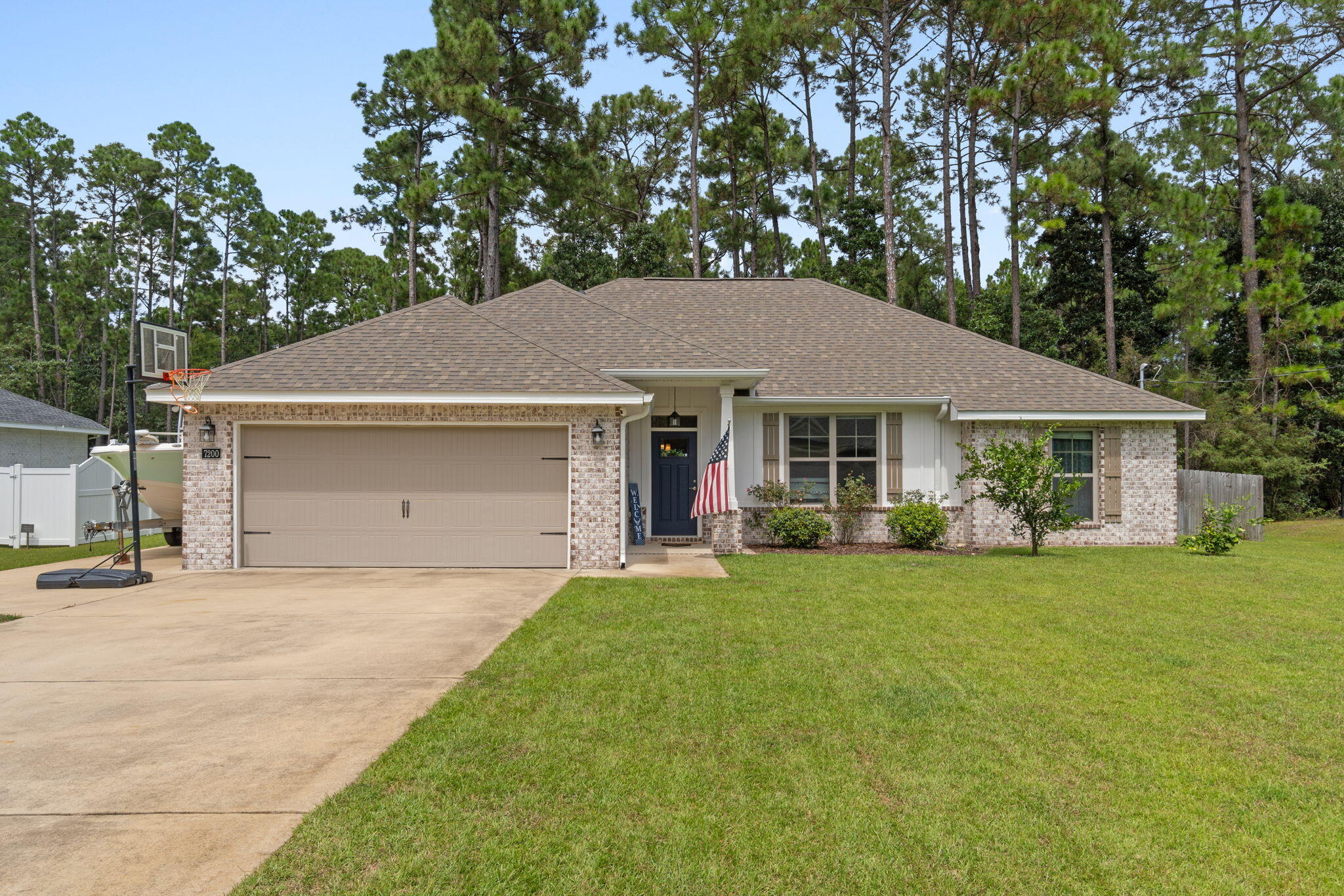 Welcome to this beautiful 2020 built home in the sought after Holley by the Sea community, offering resort style amenities including pools, tennis courts, fitness center, clubhouse, and waterfront access.This home boasts an open floor plan filled with natural light and numerous upgrades throughout. The kitchen features sparkling quartz countertops, subway tile backsplash, a slide in range, and pots and pans drawers, while the living area highlights modern finishes and durable luxury vinyl plank flooring. The spacious master bedroom includes an upgraded bathroom with quartz countertops, dual vanities, and a beautifully tiled shower. Additional enhancements include smart home features with door sensors and security panel, prewiring for home theatre surround sound, and a craftsman style front door.
Step outside to a private backyard oasis complete with a screened in patio with TV hookup, perfect for entertaining. The fully fenced yard backs to natural landscape for added privacy, while a well irrigation system keeps landscaping lush and helps lower water costs.
For outdoor enthusiasts, the side yard offers a parking pad with a 30 AMP outlet, ideal for a boat or RV. Peace of mind comes with the Taexx in wall pest control system and maintained termite protection since construction.
Enjoy modern comfort, energy efficiency, and entertainment ready outdoor living, all with access to the unmatched lifestyle of Holley by the Sea in this gorgeous Navarre home.