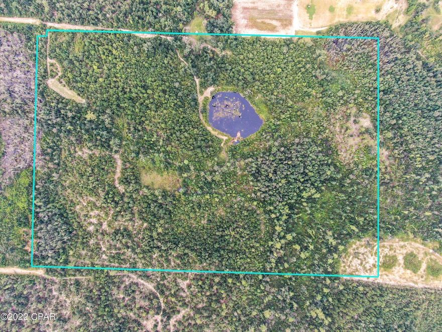 Experience true privacy on approximately 25 acres of beautiful timberland with agriculture/conservation zoning. This property is contingent upon subdividing property. MLS 916629 for full 51 acres. This property is perfect for your dream homesite, featuring two ponds and a tranquil creek running through it. The larger pond covers approximately 3 acres, ensuring a constant water supply. Enjoy the abundance of wildlife, including ducks and whitetail deer, making it an ideal spot for hunting and outdoor activities. Conveniently located behind Compass Lake Subdivision, this parcel offers multiple access points. Embrace the endless possibilities of this serene and picturesque land!