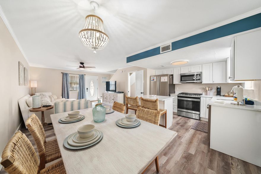 Welcome to 141 Gulf Highlands, a fully remodeled 2-bedroom, 1.5-bathroom townhome offering a perfect blend of modern luxury and coastal charm. This turnkey property has been upgraded from top to bottom, featuring all-new flooring, paint, appliances, furniture, and decor. The kitchen is a chef's dream, complete with custom wood shaker cabinets, elegant Carrera quartz countertops with striking blue veining, new stainless steel appliances, and an island that provides extra space for entertaining. New gas piping to the stove ensures ease of cooking. The upgrades extend to the bathrooms, where you'll find Carrera quartz counters, new vanities, modern gold fixtures, updated lighting, new toilets, and an upgraded tub and shower. The primary bathroom is further enhanced with coastal shiplap... for a touch of modern elegance. Additional improvements include new water piping and valves for sinks and tub, newly stained coastal blue stairs, new interior doors, light switches, and wall plugs. The owners have thoughtfully converted the bedroom closet into an owner's closet, though it can easily be made available for guests. The exterior storage closet is equipped with plumbing, making it ideal for a future bathroom addition. The home also features a custom-built TV wall in the primary bedroom, ensuring no wasted space. This townhome is situated in the exclusive, gated Gulf Highlands community, where residents enjoy access to 11 pools (5 heated), tennis and pickleball courts, shuffleboard, an 18-hole mini-golf course, and private beach access. The community features a beachside pool with private gated entry, a restaurant and bar with indoor and outdoor seating, a balcony overlooking the beach, and outdoor showers, offering the perfect beach experience. A new sprinkler system and landscaping are also being installed throughout the community at no additional cost to owners. Located just steps away from the Shoppes at Edgewater and Bayou on the Beach Restaurant, and a short drive to popular attractions like Shipwreck Water Park, Ripley's Believe It or Not, and WonderWorks, this home offers both tranquility and adventure. Additionally, this property includes a current home warranty for added peace of mind. Whether you're looking for a second home, a full-time residence, or an investment property in the Gulf Highlands vacation rental program, this townhome is an exceptional opportunity for upscale coastal living. (Buyer to verify all measurements if important.)