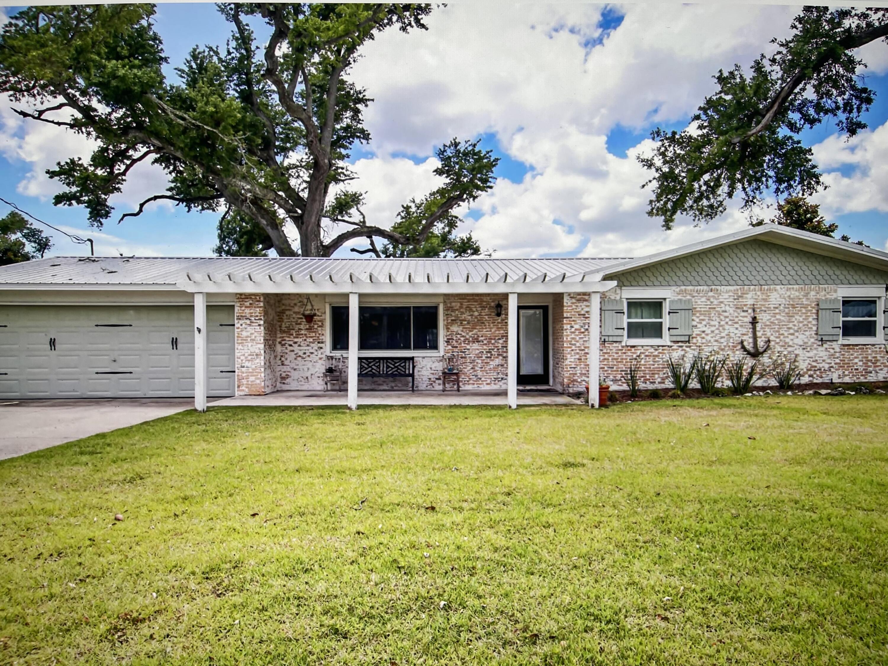 Month to month fully furnished rental! Enjoy living directly on the bay with a dock, your every own boat ramp, and a brand new hot tub. 155 feet directly on the bay with majestic southern live oak trees. 0.66 of an acre with sunrises and sunsets that will leave you breathless. Tranquil and NO HOA! The main house is 1852 sq. ft. with 3 bedrooms and 2 baths. The guest house is 504 sq. ft. with 1 loft bedroom and 1 full bath. The main house has been updated with beamed ceilings, LVP and tile flooring throughout. The chef's kitchen has a gas stove, white cabinets and suede finished granite countertops, and a down draft fan at the gas stove, Thermador double ovens, tons of cabinets, stainless steel appliances, and a brand new farm sink. There is a large breakfast bar and the dining area is large enough to seat the whole family. The open great room has floor to ceiling windows that overlook the bay with shiplap walls, pickled wood plank and open beamed ceiling. The living area is graced with a gas fireplace with German Schmear brick surround and eye-catching mantle. This home with its' open spaces is perfect for entertaining. All the bedrooms have built in's, closets, and drawers for storage. The owner's suite has a walk in closet with a secondary step in closet. The owner's bathroom has double sinks with a large tiled shower, large cooper soaking tub, and a sliding barn door. A large laundry room is located directly off of the kitchen. The garage has been remodeled and is used as a game room, but can be be converted back into a garage. The guest house out back has a kitchenette, full bath with tiled shower and floor, walk in closet, and  lofts for loft beds. The guest house has a mini-split for controlled temperature. This home on the bay has it all with almost an acre of land, its own private boat launch/ramp, seawall, dock, and views of East bay that are mesmerizing! Call for your appointment today! All measurements are to be verified by the tenant. LoKation Real Estate is not responsible for the leasing of this home. It is only listed to procure tenant(s) for owner. Rental Requirements: Security Deposit of one month's rent ($4,000), pet deposit of $400, and credit check. 
Call or text Shaunet?? at (850) 748-9455 for a showing.