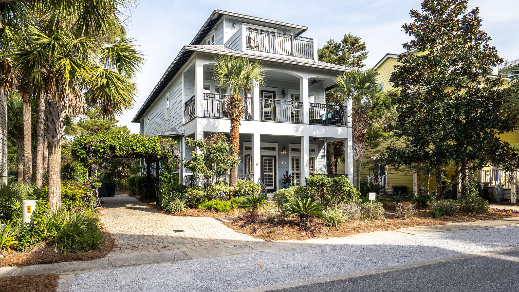 This beautiful spacious 5 Bedroom 4.5 Bathroom beach house sits on a large 50X100 landscaped lot, adjoining a park, providing plenty of space for family, guests or renters. This is one of the few 5 bedroom homes with two masters - one on the main floor, perfect for guests or grandparents. There are several porches including a large screened in porch overlooking the shaded back yard. Upstairs the master bedroom includes a bathroom with separate tub & shower and dual sinks. There is a hallway area has a trundle bed and a large flat screen TV for the kids to play video games or hang out. There are 2  add'l bedrooms sharing a jack and Jill bath. The upstairs large multi purpose room has a wetbar and a built in murphy bed for add'l guests. This is a spacious well built home on a large 50X100 Ft lot. The home sits in front of one of Seacrest Beach's parks where owners and guests can walk from the backyard to the park to play bocci ball, read or follow the walkway to the large 12,000 SF pool. The Owners have updated the kitchen painting and adding new beautiful Quartzite countertops. 
With 5 bedrooms and 4 1/2 bathrooms, this home is a great rental. There is room to expand, adding a carriage house, or pool in the backyard.
The shuttle stop to the beach is right across the street from the home, making it convenient for guests to go to the beach.
