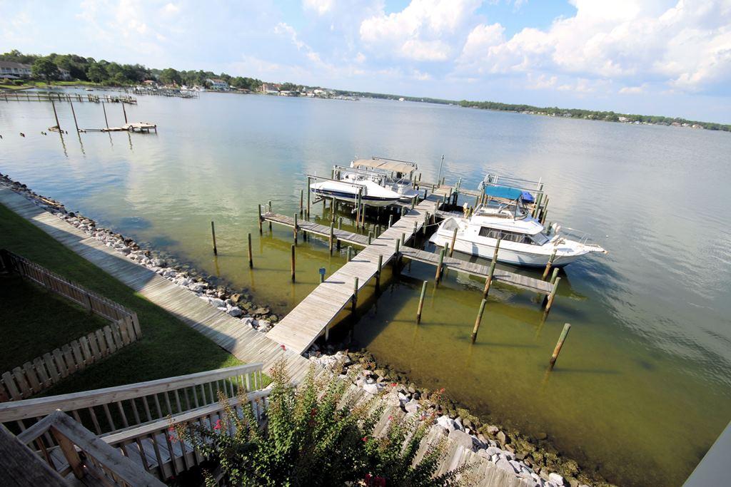 Enjoy incredible bayou views from every level of this townhome on Garniers Bayou!! If you are looking for carefree waterfront living, you have found it! Each unit comes with a DEEP WATER BOAT SLIP and #10's slip even has a boat lift. This unit has been completely renovated and is MOVE IN ready! The 1-car garage and a bedroom or an additional living room is located on the 1st level, the main living area and kitchen are on the 2nd level and the master suite and another bedroom and bath are located on the 3rd level. Each level has large sliding glass doors that lead out to your covered deck-WITH UNOBSTRUCTED VIEWS OF GARNIERS BAYOU. Conveniently located in Ft Walton Beach, close to both Eglin AFB and Hurlburt Field, you have found your waterfront paradise! DON'T let this one slip aw