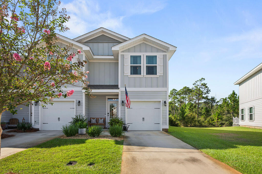 Welcome to this charming 3 BR 3 BA end-unit townhome in the highly sought-after Miller's Crossing community. Backing to protected green space, it offers serene views and lasting privacy with no future development behind. Inside, the open layout features a well-appointed kitchen with granite countertops, stainless appliances, breakfast bar, and pantry. The inviting living room area includes a stylish accent wall and plenty of natural light, while a convenient half bath is located on the main level. Upstairs, you'll find all three bedrooms, including a spacious primary suite, two guest rooms, and well-designed baths. A private garage and patio add both functionality and outdoor enjoyment. Miller's Crossing features a scenic nature boardwalk that invites tranquil walks, expansive green spaces and a dog park. The location of this lovely townhome is unbeatable. It is located minutes from Blue Mountain Beach, boutique shopping, and world-class dining. Whether you are searching for a full-time residence, vacation home, or an invetment property, this townhome offers the perfect blend of coastal living, comfort and convenience. Schedule your appointment today!