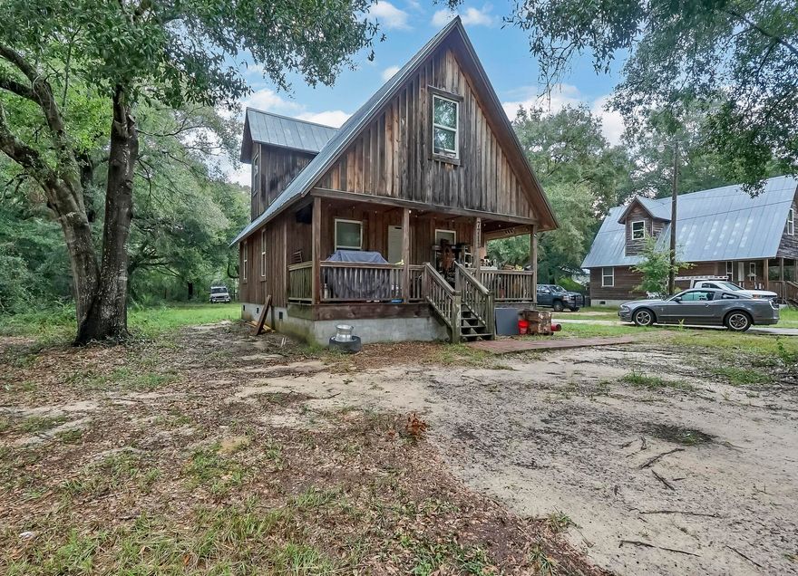 Discover Rustic Charm in this Cypress and Juniper Log Cabin near Milton Airport - No HOA Restrictions!This charming log cabin boasts that coveted country retreat feel, brimming with rustic charm. The ground floor features one bedroom and a bath, while additional bedrooms and a bath are found upstairs. Meticulously maintained and absent of homeowners' association (HOA) restrictions, this home offers you the freedom to personalize your space. Crafted entirely from juniper and cypress, with a metal roof poised for several more years of service, this cabin exudes durability and timeless character. The kitchen is well-equipped with a, cooktop, and a microwave/convection oven combo.