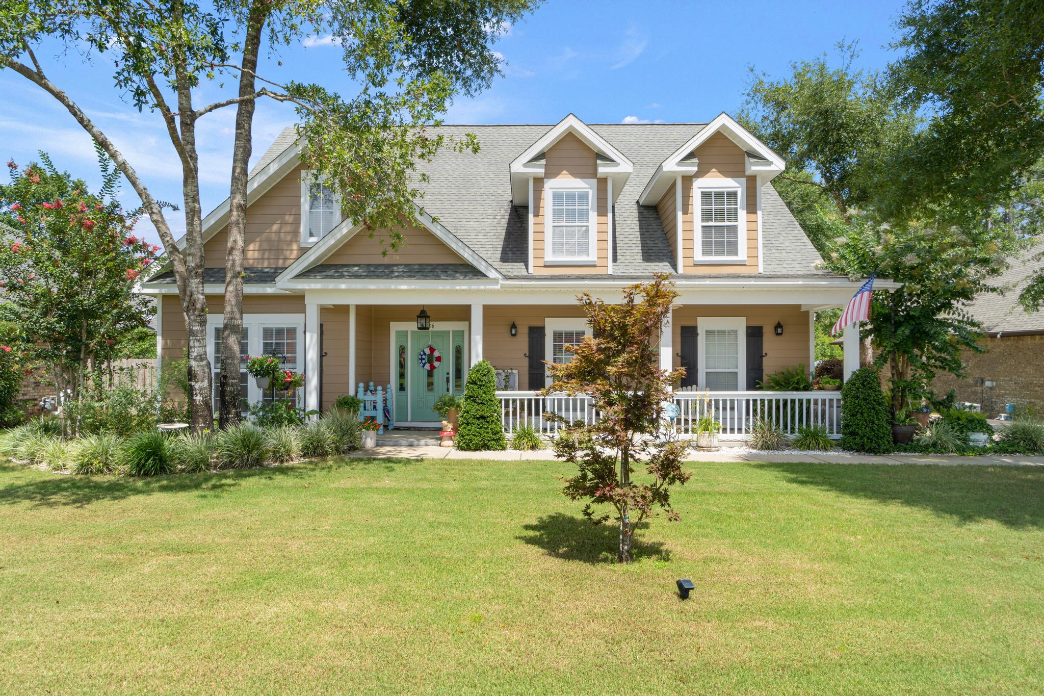 Beautiful home with large front porch in a great neighborhood. Formal entry and formal dining recently used as a bonus room. Large living opens up to a covered patio with a huge custom deck built that houses a hot tub. This home sits on the preserve so it is very peaceful. Downstairs has hardwood floors and three bedrooms, two bathrooms. Master bed and bath are on the first floor. The second floor has two bedrooms and a full bathroom. There is also a room that can be used for a office, storage, or bonus area. The home has a central vacuum. Lots of quality touches in this custom built home. This home is so unique and stands out. Come have coffee on the front porch and enjoy this beautiful neighborhood.Home recently painted on the outside/inside and deck recently stained and sealed.