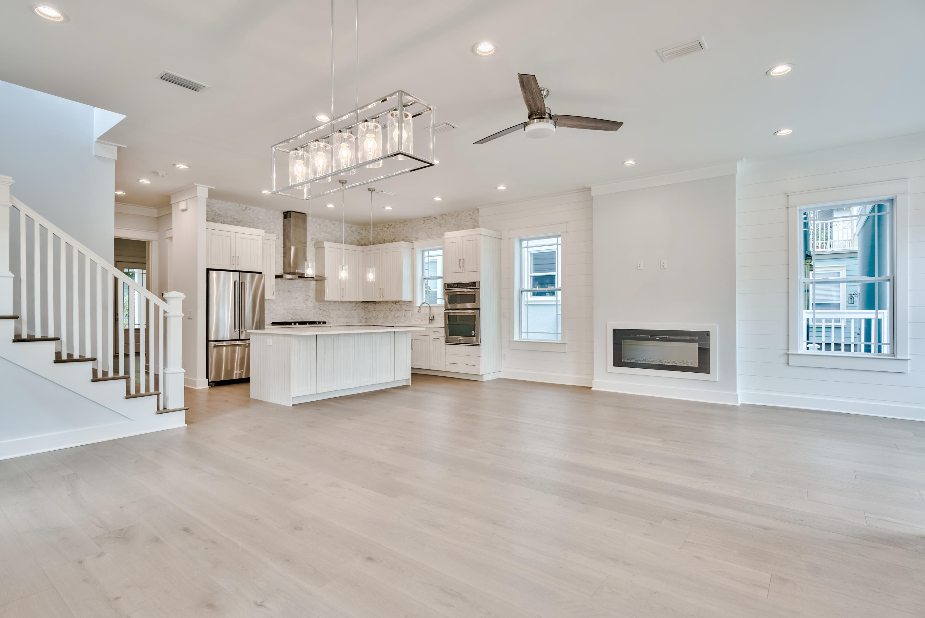 Newly completed construction by Bay Custom Builders, this beautifully designed beach house has a grand facade with porches on two levels. The entrance will invite you into a full-width living room with ample space for defined formal dining and living areas beneath an airy 10-foot ceiling. The open kitchen draws the eye with its tasteful cabinets and comprehensive range of fitted appliances. Tailor-made for gourmets and those who love to entertain, it boasts a 9-foot island which is sure to be a natural hub for hanging out or lingering over breakfast and pre-dinner cocktails. The hallway leads to a guest bathroom, laundry and master suite.