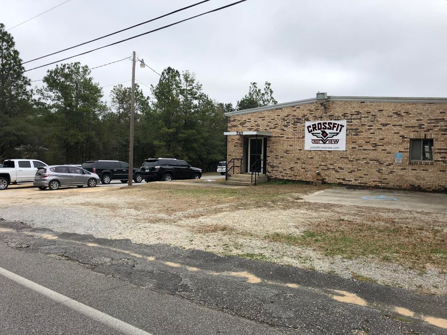 Wow, Great building and LAND. Close to the airport and not too far from main commercial areas. Bonus this is a corner lot so easy access from 2 roads! Building and land for sale. Present tenant may do lease if requested, presently month to month. The current business is a Crossfit box/or gym. Commercial zoning grandfathered in. Perfect location for a gym or any other type of commercial allowed by county. Large open plan, high ceilings with two bathrooms and an office area. Two big overhead door entrances. One has a loading dock. Approx 3236 sq ft enclosed!