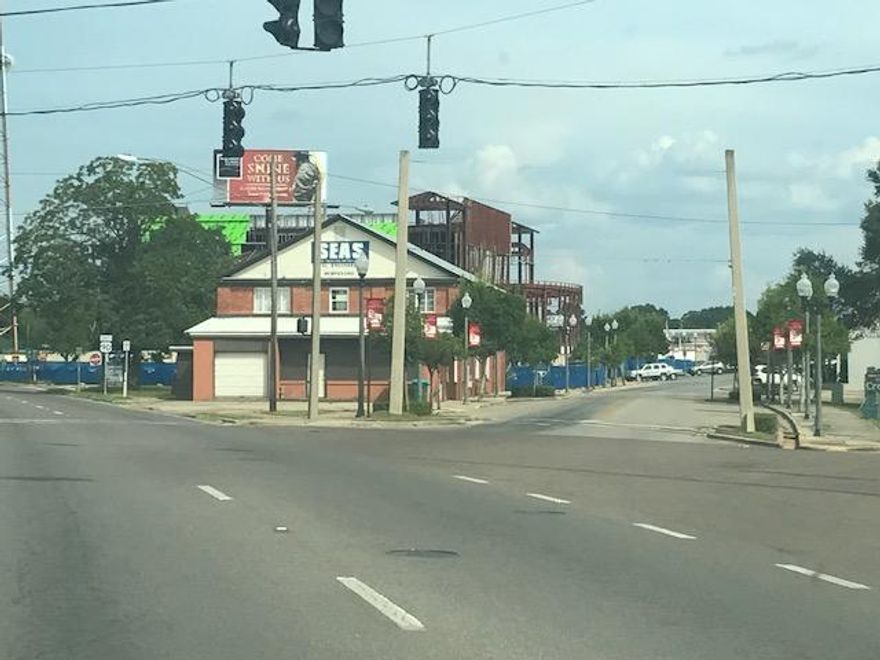Two Story Brick Building in prime location containing a total of 6800 SF, plus a 310 SF detached Garage/Storage Building. Originally built as the Masonic Lodge, more recently used as office building for engineering company. Has been renovated quite a bit since 1994 when present owner purchased. Metal Roof - 1995, new windows downstairs, new wiring, extensive security system added. Building consists of high ceilings, wide hallway and has a good deal of character. In front on new Court house, PRIME Location - Highly visible from all directions - when stopped at traffic light it is right there! Ideal for Attorney's Offices, various other professional uses, to use as one building or lease out smaller spaces. Additional Income from LAMAR Sign rental -$350 P/Mo. now, increased potential.
