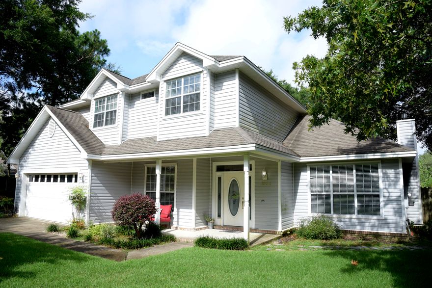 Enjoy the gated community of Parkwood Estates and the amenities of Bluewater Bay!  This lovely 2 story home features hardwood, carpet and tile flooring with a large eat-in kitchen, stainless appliances including a gas stove and granite topped island. A swing room, accented by french doors, can be used as an office, game room, or formal living or dining room. The great room features a gas fireplace with travertine tile surround. Upstairs you'll find four spacious bedrooms with the master having a walk-in closet and oversized bath with double vanities, separate shower and whirlpool tub. A large screened in porch overlooks the fully fenced backyard.  Downstair AC new in 2020. Call today to schedule your showing of this beautiful home in one of Niceville's most sought after locations.