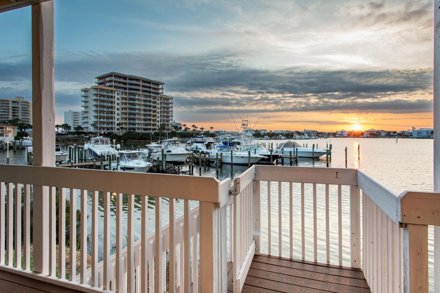 PRICELESS VIEW OF DESTIN HARBOR!  This renovated, fully-furnished 2 bedroom, 2 bath condo features one of the best views in Sandpiper Cove!  Kick back with your favorite beverage, watch the boats, and enjoy the fabulous harbor sunsets from its oversized balcony with updated Trex decking. Step into elegance as you enter this on-trend decorated condo with beautiful paint and upgraded flooring throughout! The living area has integral shelving with TV and built-in speakers, and an electric fireplace with optional heat. Savor the harbor view through two sets of updated, UV coated and hurricane-grade glass sliders that open onto the expansive balcony. Cooking is a delight due to the granite countertops, upgraded kitchen cabinets, new ceiling fixture & pendant lights, stylish backsplash, and