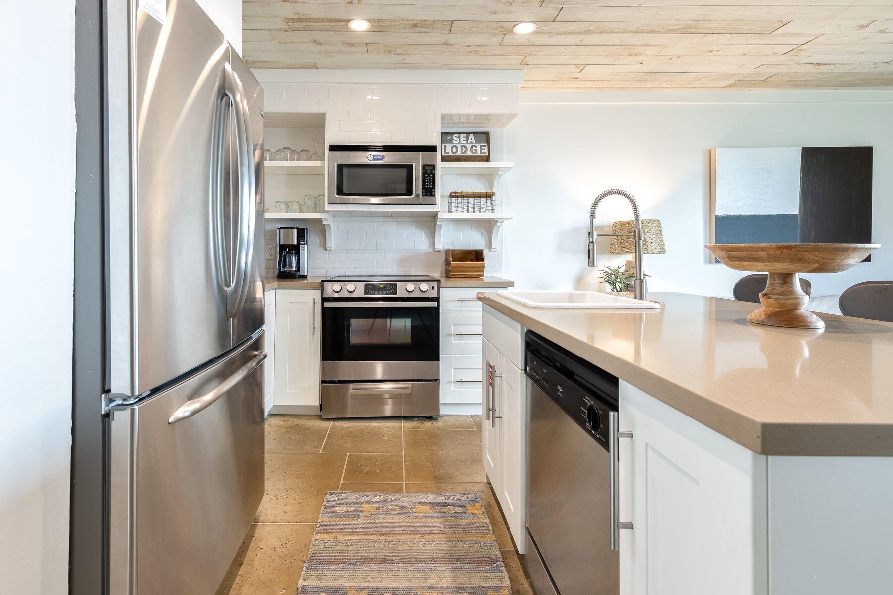 This cozy beachside condo offers a peaceful gulf-front location, it has everything you need to enjoy the perfect beach vacation while also being close to all the action on 30A. Located on the first floor of a low-rise building, it's an easy walk out to the white sand from the comfortably furnished sitting area. Sliding doors open onto a deep patio overlooking a grassy area just steps from the sand. Wood plank ceilings, barn door accents, and a natural color palette deliver a sophisticated rustic look. The kitchen has stainless steel appliances and open shelving makes everything within easy reach. A center island houses the dishwasher beneath a countertop that extends as a breakfast bar with three stools for casual dining. The bedroom is furnished with a queen-size bed and a large screen Built-in bunks in the hallway make this a very family-friendly condo. This condo includes a family bathroom with a tub shower combo and the added convenience of a stacked washer/dryer. Centrally located within Seagrove Beach, this beachfront complex is a short bike ride to Seaside, Florida for live music, shopping and a range of casual to fine dining. The 19-mile paved bike path that parallels Hwy 30A is conveniently located in front of the complex. A beautiful community pool, deeded beach access and a grilling area make this the perfect vacation getaway. Rental ready, this charming condo is well-established on a rental program and ready for its new owner.