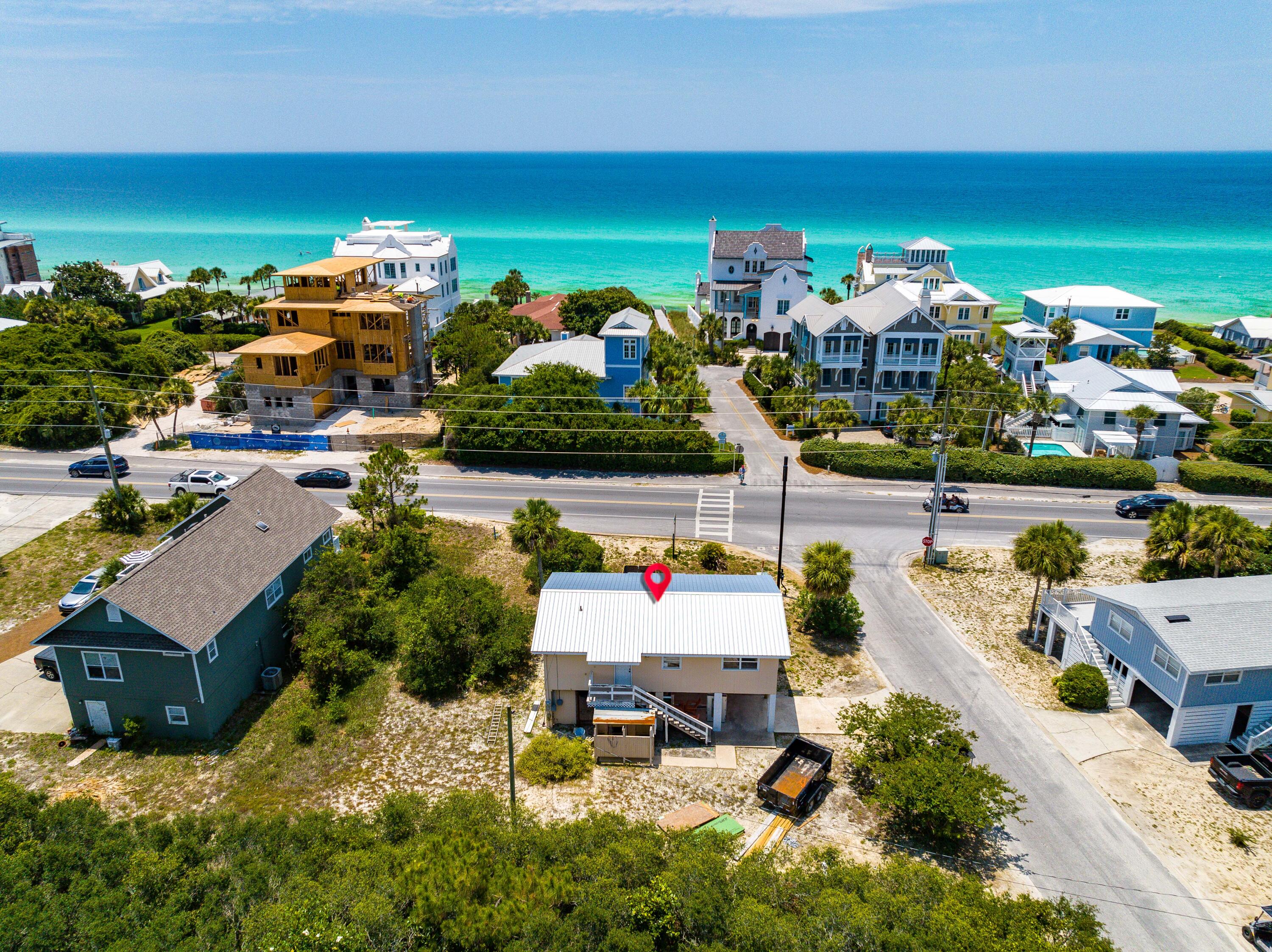 An incredible opportunity to build your dream house on an oversized corner homesite in the heart of Seagrove Beach! The possibilities are endless! Create the 30A retreat of your dreams with .2 acres of prime real estate fronting Scenic Highway 30A and only steps to the public beach access. A natural buffer of trees on the north boundary provides privacy in this established area of Seagrove. Popular with families, the lively Seagrove Beach community features local restaurants, boutique shopping, activities, and a convenient location between Seaside and WaterSound Beach. Park your car and walk, bike, or golf cart to anywhere you want to go! Don't miss this rare offering!