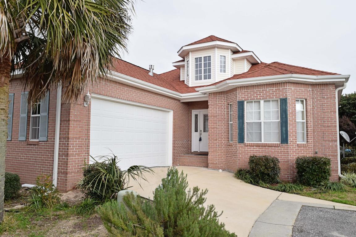 Beautiful home in gated Magnolia Plantation. Entry leads to the grand dining room with soaring tray ceilings. Kitchen boasts Corian counter tops, high cabinets, tile back splash and under cabinet lighting! Kitchen overlooks large living room also with modern, wood-look tile flooring. Living room boasts custom-tiled gas fireplace, built-in shelving, handy wet bar, recessed lighting, crown molding. Large master bedroom, spacious master bath and master closet. Double vanity, shower and garden tub. Spare bedrooms feature lots of closet space and share a full bath.