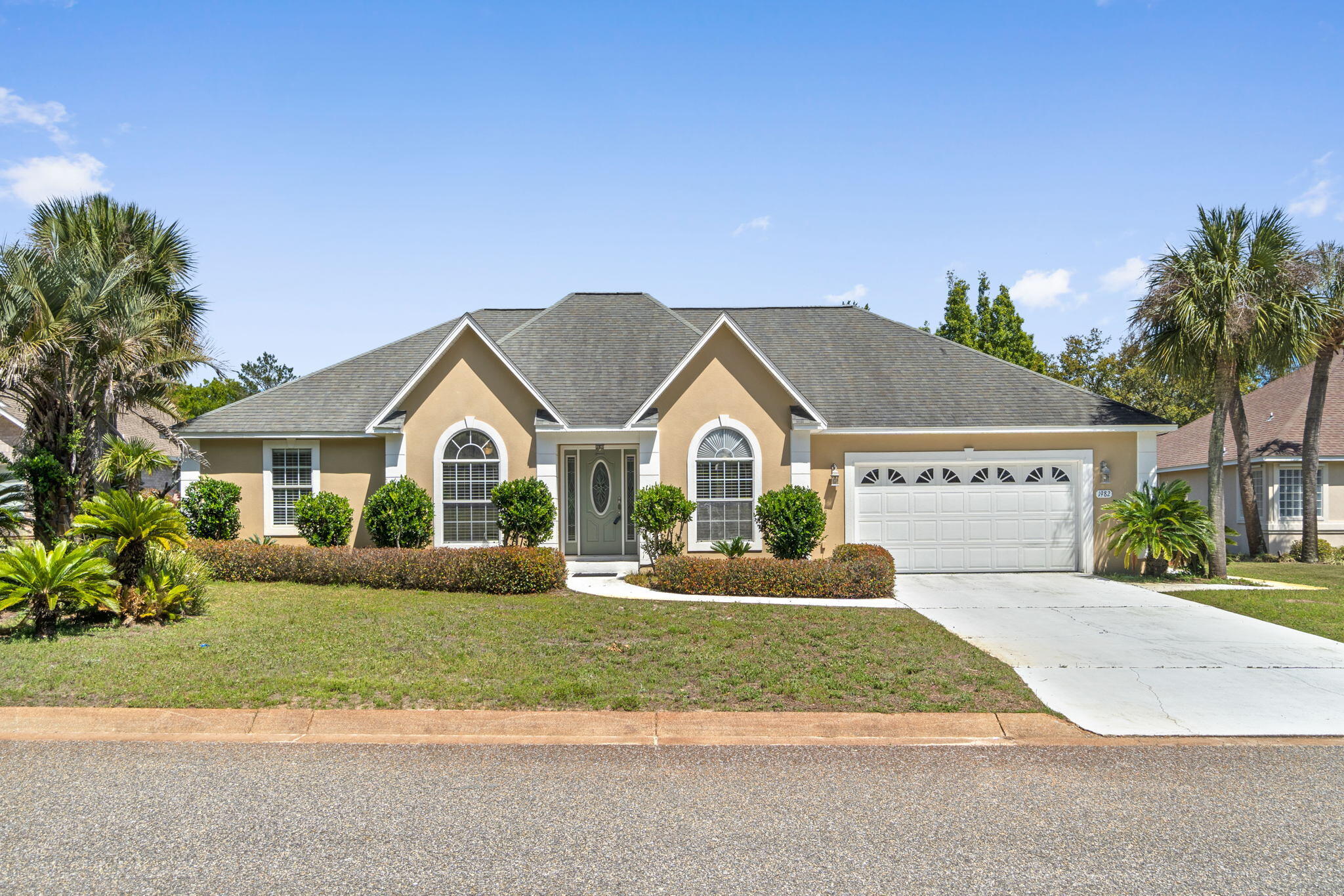 Say hello to this fabulous Navarre pool home complete with many high end updates from floor to ceiling. Inside enjoy the spacious open floor plan including tile floors, fresh carpet, 4 bedrooms, 2 bathrooms, a formal dining area and breakfast nook, all completed with an enclosed Florida room. The Florida room is fully tiled and screened and includes custom fitted windows which can be installed after closing should you choose. The kitchen is equipped with stainless steel appliances, quartz countertops, and a gas stove certain to make your inner chef swoon. The master bedroom and bathroom are a work of art with trey ceiling in the bedroom and a double sided fireplace. The bathroom features double vanities, a tiled luxury shower, and the most picturesque garden tub in town. Outside features