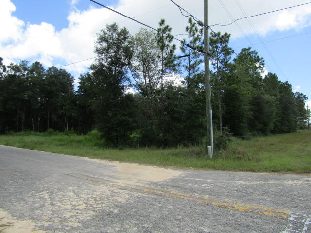 +/- 2.27 Acres at the corner of Poverty Creek Rd and Sand Hill Rd. Very desirable area for building located on 2 paved roads. This area feels like you're living in the country but still convenient to town. There are 2 parcels being sold together as one for a total of +/- 2.27 acres. Parcel # 29-4N-22-0000-0001-0680 and Parcel # 29-4N-22-0000-0001-068A. This property can be divided into 3 buildable lots with county approval.