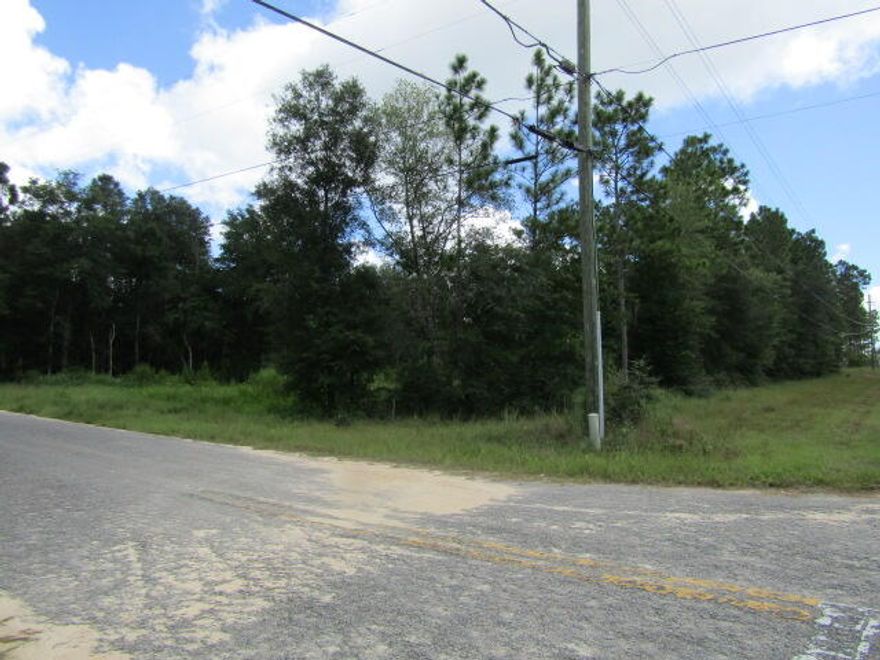 +/- 2.27 Acres at the corner of Poverty Creek Rd and Sand Hill Rd. Very desirable area for building located on 2 paved roads. This area feels like you're living in the country but still convenient to town. There are 2 parcels being sold together as one for a total of +/- 2.27 acres. Parcel # 29-4N-22-0000-0001-0680 and Parcel # 29-4N-22-0000-0001-068A. This property can be divided into 3 buildable lots with county approval.