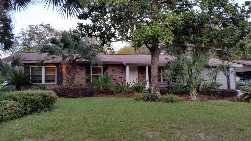 Cute all brick home convenient to Eglin AFB, Hurlburt Field, schools, restaurants, shopping and short drive to beautiful, white, sand beach. This home has great curb appeal with lush landscaping and park like setting. Home lives larger than square footage indicates with 2 living areas. You can expand your entertainment area to the 12x29 screened and tiled porch with hot tub and built-in table overlooking the beautiful rear yard. Kitchen opens to family room and has abundant cabinets, drawers and counter space plus a pantry and computer desk. Tile floors, crown molding and 5'' baseboards throughout the home. Seller says windows were installed in 2010 and dimensional shingle roof in 2013. Extra large drive for parking of boat or RV. Yard building is 12x20 for good storage.
