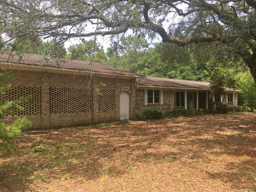 Enjoy the peaceful and tranquil lifestyle in this 3BR/2.5BA home situated on 5 areas of pure solitude! This 2,169 sq. ft. fixer upper features a large carport/garage with 2 office spaces and a half bath, a formal dining room, spacious living room, laundry room, Florida room, family room with fireplace and an open concept kitchen. **Property includes two separate parcels** All Information recorded in the MLS is intended to be accurate but cannot be guaranteed, buyer advised to verify. Sold As-Is. No utilities will be turned on to this property and only cash/renovation loan offers with 0 day inspection period will be considered. Buyer should perform their due diligence/necessary inspections before submitting an offer.