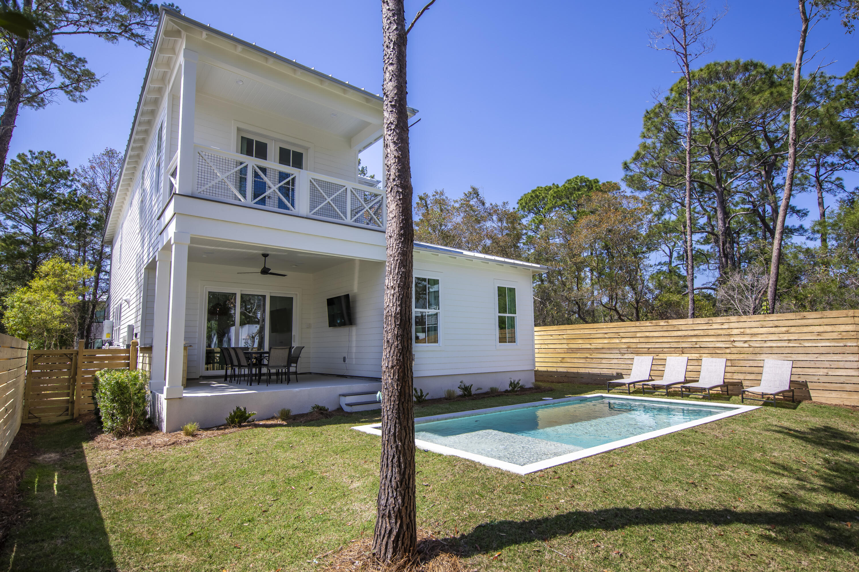 Discover your new sanctuary at 276 Clareon Drive, a fully furnished coastal haven just moments away from the enchanting beaches of 30A. Step into a luminous, open floor plan that effortlessly combines comfort and functionality exuding a welcoming ambiance. At the heart of this residence lies a gourmet kitchen, offering top-tier appliances, beautiful countertops, and abundant storage. With three generously proportioned bedrooms, each featuring its own en suite bathroom, and an expansive bunk area for additional guests or flex space. Venture outside to your private oasisan expansive lot offering year round play. The heated private pool and yard is sure to be a hit!