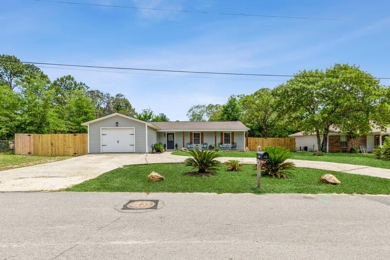 Beautifully renovated 3 bed, 2 bath craftsman in Mary Esther! This 1,200 sq ft home features new LVP flooring, smart thermostat, 2024 HVAC w/ UV Light, new water heater, and 2024 roof. Kitchen boasts stainless steel appliances, subway backsplash, and new blinds. Both baths updated with modern vanities; master has en suite with tiled shower and ceiling-mounted shower head. Spacious fenced backyard with covered patio and large shed (conveys)as-is. Covered front porch with updated pillars and shutters. Shed has a powered garage door and 30amp hook-up . Fenced in seperated dog area this home is Move In Ready!