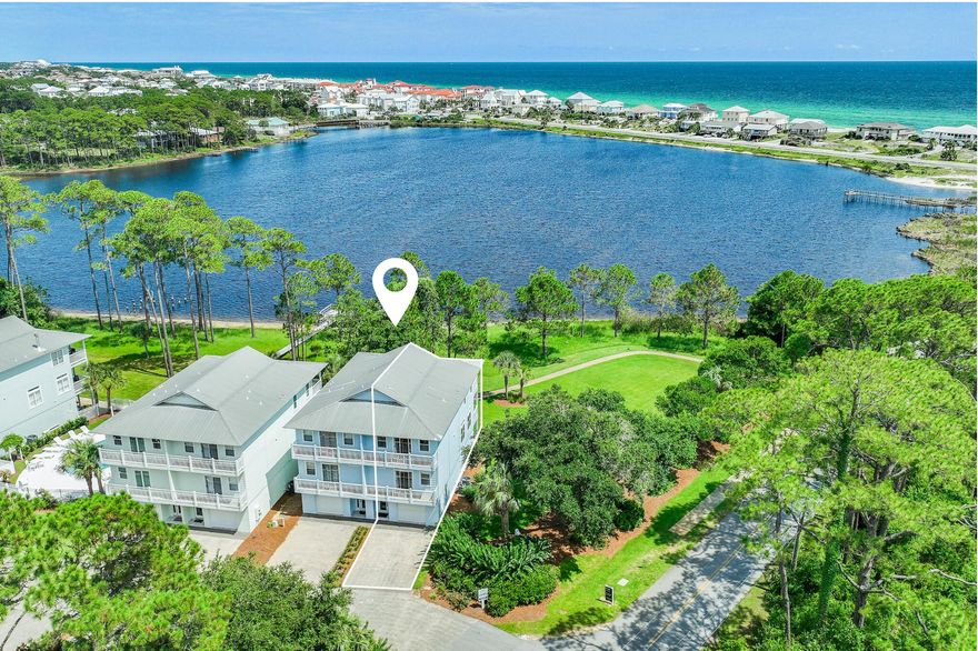 Nestled on Oyster Lake, a coastal dune lake in Dune Allen Beach on 30A, this rare coastal retreat recently refreshed by the team at Lusso Interiors boasts three distinct levels totaling over 2,500 square feet offering breathtaking views of the Gulf and the surrounding topography. Upon arrival, the foyer leads to the first-floor mother-in-law suite, currently configured as a guest suite and secondary living area, complete with a private bathroom.  Ascending to the second floor, the heart of the residence unfolds into a sophisticated living space designed for relaxation and entertainment. Generously sized living and dining areas are adorned with tall ceilings and coastal chic furnishings. The covered terrace, spanning the full width of the space, offers breathtaking 180-degree views of the lake. Ideal for culinary enthusiasts, the gourmet kitchen boasts custom cabinetry coupled with newly installed quartz countertops, a luxury appliance package and a kitchen island with integrated seating. Just down the hall, a guest suite is flooded with natural light and features an ensuite and covered terrace, perfect for enjoying a morning cup of coffee or an evening read while listening to the birds chirp or the sound of waves crashing onto shore in the distance.

The primary suite, nestled on the third level, is a haven of relaxation, bathed in natural light from a wall of windows that offers breathtaking views towards the Gulf and lake. With its spacious seating area and direct access to a private terrace, it's the perfect spot to witness the mesmerizing hues of the Emerald Coast sunsets that paint the sky each night. The sumptuous ensuite provides a spa-like experience, complete with a soaking/shower tub combo and a double vanity. The uppermost level also features an additional primary suite with terrace access, 2 closets and full bath.

This unit is a sanctuary, and a true rarity to the market. Enjoy something no one else has - a true solid product with concrete construction on first floor, gorgeous gulf and lake views, an end unit bordered by preserve area, 2 king suites, each bedroom is equipped with en-suite and terrace, and a community pool and dock access all while remaining a SHORT walk away from the turquoise-hued waters. The lakefront units in this complex seldomly come to market so now is the perfect time for you and your family to start living the coastal lifestyle you truly deserve.

When it comes to ultra-luxe gulf side living, the allure and stature of Dune Breeze Villas remains unrivaled. The culmination of luxury and exclusiveness creates an intimate setting while remaining geographically poised seconds from the beach access along with all of the acclaimed dining and entertainment 30A has to offer. This unit has impressive rental potential of over $75,000 annually creating a compelling opportunity for investors and second or full-time residents alike.

The "town center" at Gulf Place featuring Shunk Gulley Oyster Bar, Pizza by the Sea, Renaissance French Restaurant, Sunrise Coffee, Perfect Pig, Shelbys, Pecan Jacks, Jonah Papa Surfs and local boutiques with walking & biking trails is also poised just a few minutes away.