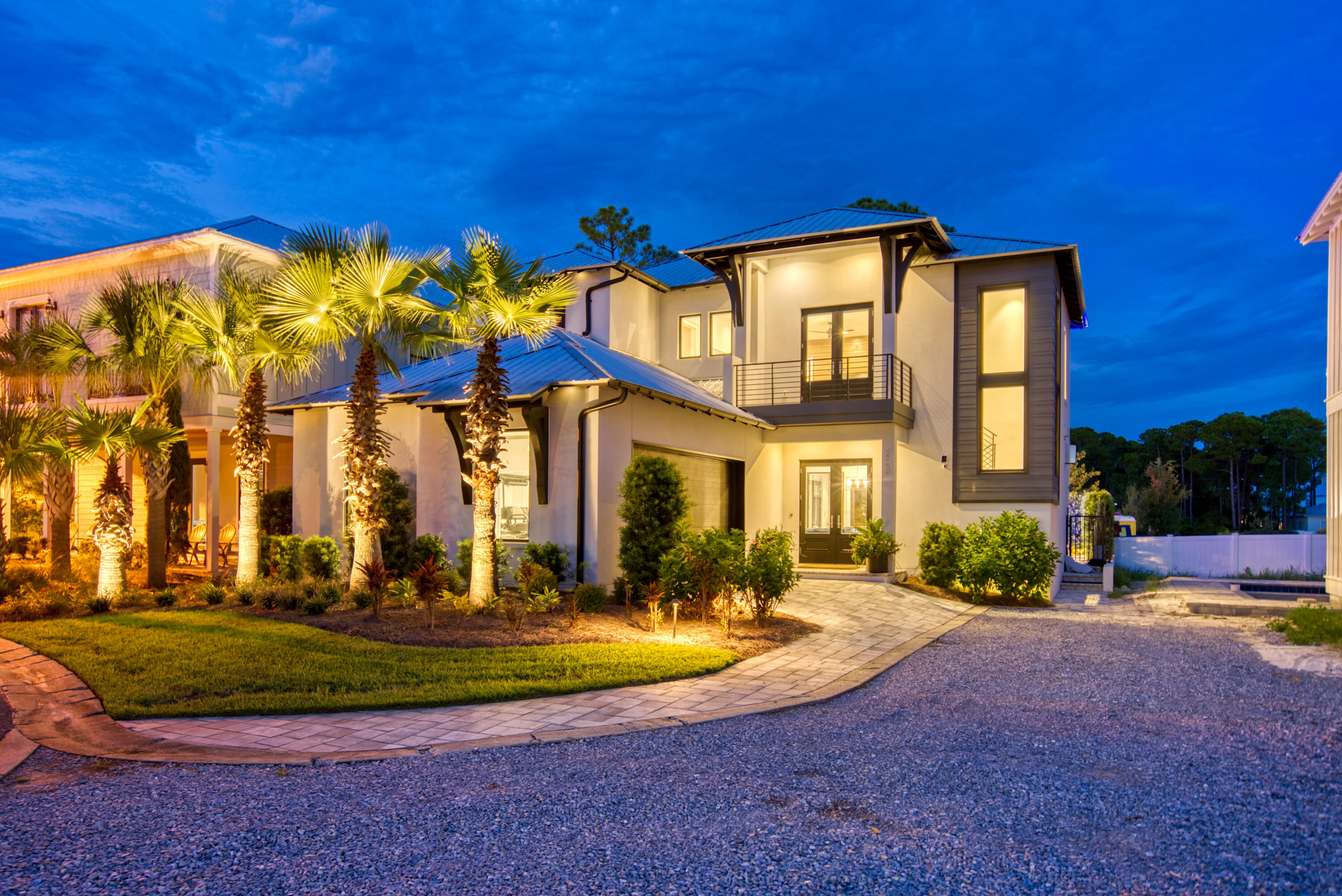 Contemporary meets coastal! Come fall in love with this one of a kind custom home in the private gated community of Emerald Waters Village! This short term rental friendly neighborhood offers DEEDED beach access along with two community pools. Masterfully thought out, this home was professionally designed and features custom finishes hand crafted by The Iron Grove. With rental projections of +$185,000, this is the perfect opportunity for any investor! Upon entering the home, your eyes will instantly be drawn to the floor-to-ceiling windows along with the reclaimed wood accent wall featuring the contemporary Heatnglo gas fireplace. The outdoor courtyard is the perfect place to take a dip in the saltwater pool and relax after a long day.