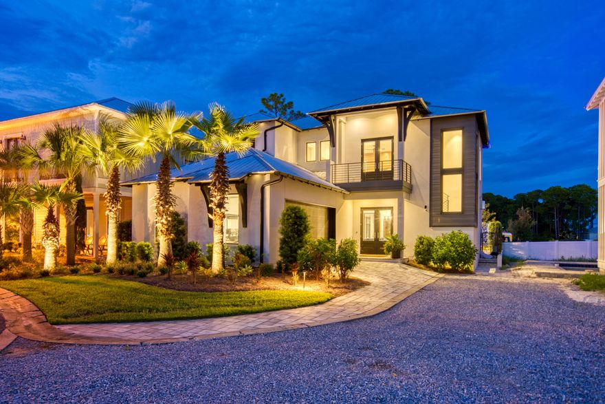 Contemporary meets coastal! Come fall in love with this one of a kind custom home in the private gated community of Emerald Waters Village! This short term rental friendly neighborhood offers DEEDED beach access along with two community pools. Masterfully thought out, this home was professionally designed and features custom finishes hand crafted by The Iron Grove. With rental projections of +$185,000, this is the perfect opportunity for any investor! Upon entering the home, your eyes will instantly be drawn to the floor-to-ceiling windows along with the reclaimed wood accent wall featuring the contemporary Heatnglo gas fireplace. The outdoor courtyard is the perfect place to take a dip in the saltwater pool and relax after a long day.