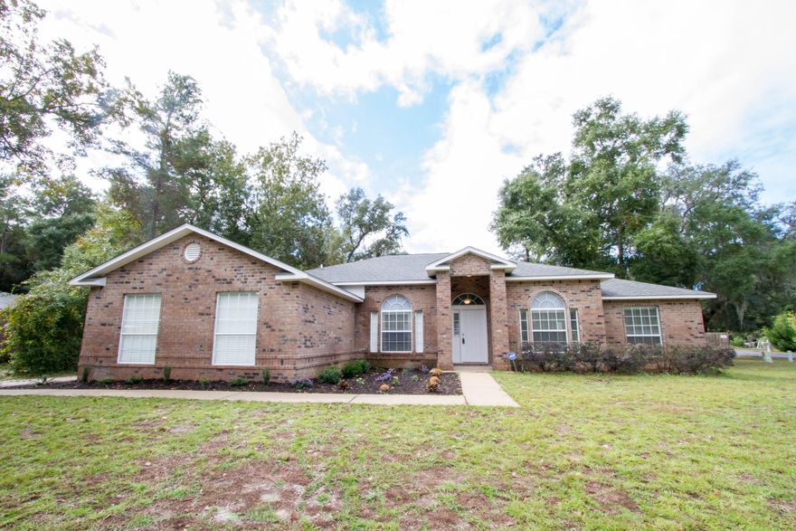 Welcome to the waterfront community of Waterview Cove. This home is tucked away allowing for privacy. The home is constructed of brick with vinyl trim for easy maintenance. The home boasts the split floor plan with a open family, dining and kitchen area. When you arrive at your new home on Cedar Place you will find the brick columns and door with side glass. Once inside the home you will see the openness so you never feel separated from others. From the dining room to the great room you will be able to carry on conversations. The great room has vaulted ceiling, a wood burning fireplace with mantel and ceiling fan. The kitchen is a delight with hardwood cabinets for plenty of storage and a pantry. Island has corian surface and electricity The stainless steel appliances with black accents include the smooth top range, dishwasher and microwave. The refrigerator with ice maker will convey.  Kitchen flooring is hardwood and there is room for a breakfast table.  The master bedroom is off the kitchen and is a fantastic size.  Plenty of wall space for you to arrange your furniture just the way you want!  The master en-suite has not one but two large walk-in closets, a whirlpool tub for relaxation, a separate shower, and a double vanity with plenty of storage.  The additional 3 bedrooms are on the other side of the home with a guest bathroom.  This bathroom has combination tub/shower and vanity with cabinets.  There is a linen closet in the hallway for storage.  The farthest back bedroom of the 3 has a double closet which is great for organization and storage.  The laundry room is inside with additional closet for storage and shelving for your organizational needs.  The garage has an auto opener.  The back yard is fenced for privacy and has a sprinkler system for maintaining the lawn. The home is also equipped with an alarm system.  The owner will provide a 1 year home warranty for the buyer at closing.  Freeport is growing and looking for a new homeowner right here in Waterview Cove.  Come check out what this fabulous neighborhood and home have to offer you.  Call and make an appointment today!