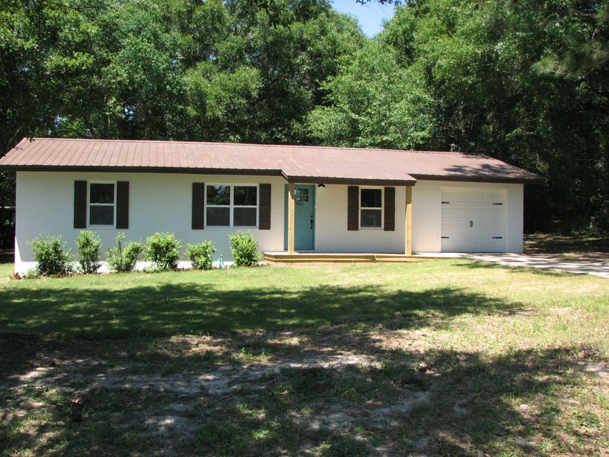 PROFESSIONAL REHAB / EVERYTHING NEW! Great Starter home on oversize lot, affordable 3-bedroom just completed for NEW owners! NEW appliances, NEW cabinets NEW counters NEW sink. The living space is open to the kitchen. NEW laminate vinyl flooring in main areas and NEW carpet in all bedrooms. NEW air conditioning unit NEW double pane windows NEW lighting & fans, NEW bathroom, NEW insulation, NEW garage door NEW plugs & switches, NEW paint inside & out, NEW sodded front yard, & NEW front porch. Large mature shade trees canopy your private 1/2 acre oasis right in town. Conveniently located near schools and essential shopping. All work was done or contracted out by an experienced, knowledgeable & successful rehab professional.