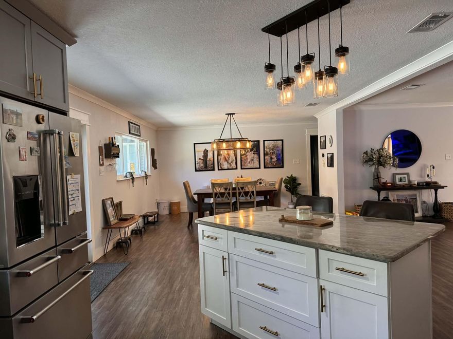 Professional photos coming soon! Rare opportunity to own a nearly one-acre fully renovated property with a saltwater pool, large shop with ADU, boat access, and wooded privacy in Fort Walton Beach.This exceptional property backs up to peaceful wooded surroundings and offers a rare combination of privacy, space, and extensive modern upgrades. The home has been extensively renovated from top to bottom and features a fully remodeled kitchen with new cabinetry, granite countertops, and new appliances, beautifully updated bathrooms, and all new windows and exterior doors. The inviting living area is highlighted by an electric fireplace, creating a warm focal point for the home. All bedrooms are generously oversized, and the primary suite has been expanded to include a massive custom walk-in closet created from a converted bedroom, offering exceptional dressing and storage space rarely found in homes of this size. Major system upgrades include a new roof and A/C replaced in 2024, providing peace of mind for years to come.

Step outside to enjoy the saltwater pool installed in 2024, complemented by new irrigation and landscape lighting throughout the property. The fully fenced yard includes a 20-foot access gate, allowing easy entry for boats, RVs, trailers, or additional vehicles to the rear of the property.

A standout feature is the 30x40 shop built last year, which is spray-foam insulated for superior energy efficiency and includes a 700 sq ft ADU with 2 bedrooms and 1 bath. This flexible space is ideal for guest quarters, rental income potential, multi-generational living, or a private office or studio. Additional highlights include an oversized temperature-controlled garage and a chicken coop built last spring, adding charm and functionality.

With nearly an acre of land, wooded privacy, extensive renovations, boat and RV access, and a versatile shop with ADU, this property offers a unique opportunity just minutes from the beaches, shopping, dining, and military bases in Fort Walton Beach.