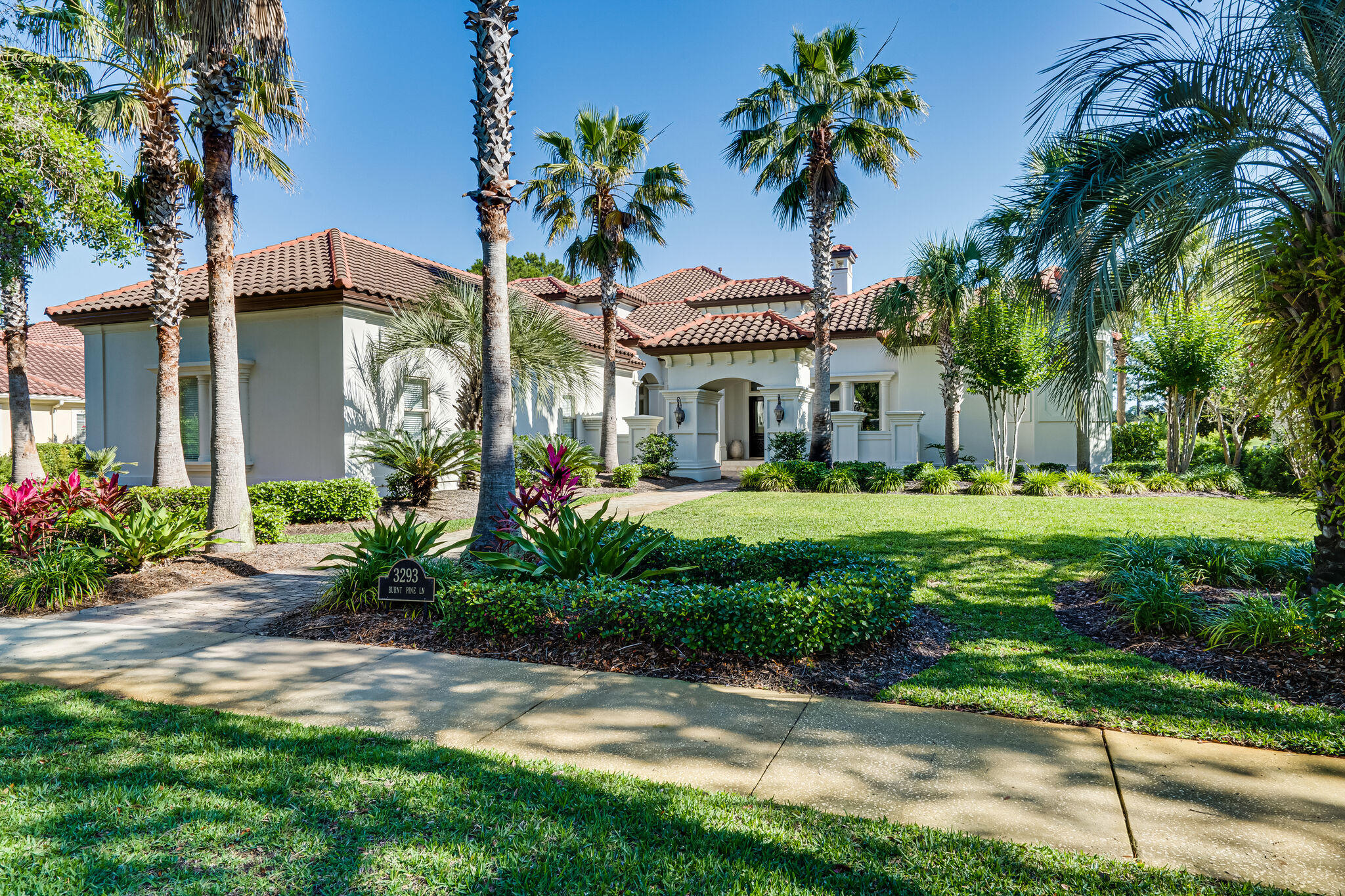 Experience lakefront living at its finest with this gorgeous home located at Sandestin Golf and Beach Resort's exclusive Burnt Pine community. Beautifully designed, no detail has been overlooked. This stunning Mediterranean inspired villa is characterized by traditional stucco exterior and interior custom features that include rich stone, textured woods, and exquisite wall coverings. The well-appointed first floor offers dramatic ceilings with tray lighting throughout, a private master wing, separate guest suite, and ample living areas. A temperature-controlled wine cellar complete a connoisseur's dream. The spacious family room flows graciously into an outdoor oasis where you will find an entertainer's paradise including a large climate controlled summer kitchen, stone fireplace, seating