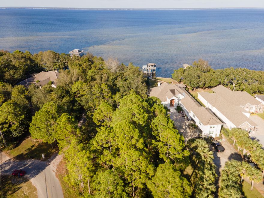 JUST CAME BACK ON THE MARKET!! ESTATE SALE... This estate-sized bayfront lot is perfect for your next home. Private and at the west end of McMansion Row. Nearly one full acre with more than 100 feet of pristine waterfront. Beautiful mature hickory trees and appears to be high and dry. Private yet convenient to world-class shopping, dining and the of course, the famous white sand beaches of South Walton on the Gulf of Mexico. No HOA to deal with. All information to be verified by buyer.