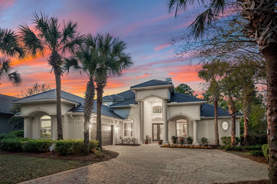 Beautiful custom home overlooking the lake in exclusive gated golf community of Regatta Bay. Featuring a BRAND NEW ROOF, this Sugar Beach Interiors designed home is also being offered furnished, minus a few small exclusions. It's also been very lightly used as it's been a second home for the last 17 years. Upon entering the home you will immediately notice the soaring 22 foot ceilings in the great room offering tons of natural light and the large enclosed lanai encompassing the private pool. The main level of the home features all three bedrooms, private office with built-in bookcases and French doors, formal den with gas fireplace, another living room off the kitchen, and the kitchen features a new GE Profile refrigerator, new dishwasher, and recently replaced oven. The kitchen also offers a large breakfast bar with pendant lighting, two sinks, a large walk in pantry, and a breakfast area overlooking the pool. The primary suite overlooks the pool and the primary bathroom offers a jacuzzi tub, large walk-in shower, and two walk-in closets. Also on the main level is a gorgeous formal dining room with custom cabinetry, wine fridge, and an ice maker. The pool and lanai are easily accessible through stacking glass pocket doors off the living room, formal den, as well as the primary suite. The attractive staircase with custom stainless steel railing takes you to the upstairs bonus loft with it's own full bathroom, as well as large balcony overlooking the pool and lake. Other features of this home include built-in surround sound, central vacuum, attractive landscape lighting, centrally monitored alarm system, floored attic space over the garage for extra storage, oversized garage with plenty of room for two cars plus a golf cart, and the home's exterior was completely repainted in the last several years. The home is located in Flood Zone X so flood insurance is not required. The golf cart is also included in the sale. Regatta Bay is Destin luxury living at it's finest. Some of it's amenities include a 6,894-yard, par-72 course named one of Golf Digest's "Top Places to Play in North America", clubhouse offers first-class dining, tennis courts, community pool, playground, and walking paths. There is a private gated entrance on the North side offering easy access by golf cart or car to the Destin Middle School, as well as Legendary Marine and Yacht Club! The Destin Commons Shopping Center as well as Whole Foods are easily accessible by golf cart without every having to get on Highway 98. And don't forget, the beach on Scenic Hwy 98 is just a mile away and is also accessible by golf cart! Buyer to please verify all information contained herein. 