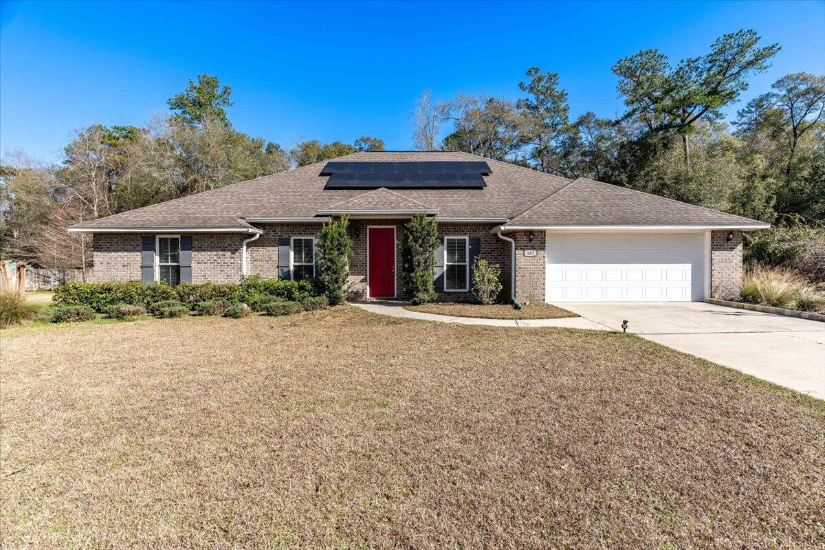 SELLER TO PAY OFF SOLAR PANELS with reasonable, agreed upon full price offer. Welcome home to 147 Old South Drive, nestled within the highly sought-after Ashley Place subdivision. This exquisite all-brick, single-family residence, built in 2016, offers an expansive 1.39-acre lot on a tranquil cul-de-sac, ensuring unparalleled privacy and space. Step inside to discover five generous bedrooms and three well-appointed bathrooms, making it an ideal retreat for those who love to entertain guests. The property features a convenient split floor plan, enhancing the sense of privacy and space within the home. The gourmet kitchen boasts granite countertops, an undermount deep sink, upgraded appliances, and an inviting eat-in area. The breakfast bar is perfect for casual meals or conversation while cooking or for more formal occasions, the elegant dining room awaits! The large living area exudes sophistication with tray ceilings, crown molding, and bull nose corners, creating an atmosphere of refined comfort. The large primary suite provides a lit tray ceiling and a primary bath with double vanity, two spacious walk-in closets, a luxurious walk-in tile shower, and a separate soaking tub. Step outside to the covered back porch and revel in the tranquility of your fenced backyard, perfect for outdoor living and entertainment. Green living enthusiasts will appreciate the solar panels, which the seller will consider paying off at closing, with a full priced reasonable offer. Additional features include a driveway with ample space for 6 or more vehicles, a sprinkler system, underground utilities, and the innovative Manabloc Pex water system. This magnificent residence is a rare find for those in search of ample space, modern amenities, and a touch of luxury. Don't miss the opportunity to call 147 Old South Drive your new home.
