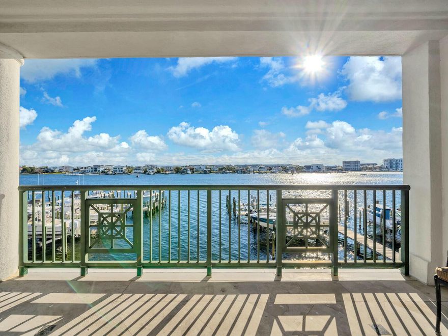 Boating enthusiasts, take note - this RARE Destin property features a large private boat lift complete with a custom fish-cleaning station! This elegantly designed 3BR/ 3BA condo located at Tranquil Harbor is perched on a bluff overlooking the Destin Harbor combines luxury, serenity, and functionalityThis condo comes with a deeded slip featuring a recently installed 20,000lb boat lift, a custom-built large cleaning table, and the ability to accommodate a 36' to 40' boat--one of the few properties on the Destin Harbor with such a capability. Equipped with a full electrical pedestal, water hookup, and a remote control to operate the lift from inside your boat. From the moment you step inside, you're greeted by breathtaking harbor views that flow seamlessly into an open floor plan, giving the  space in natural light through corner windows facing east and south.