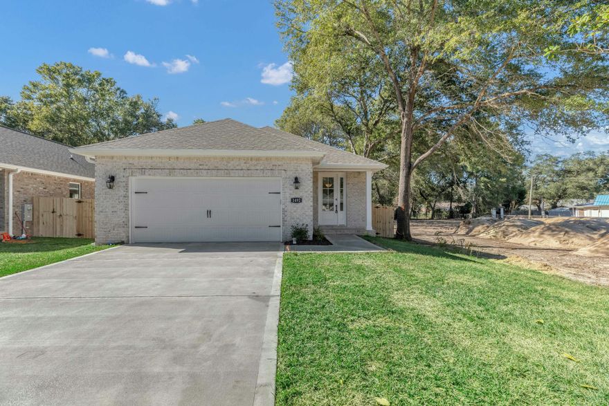 Seller concessions Up to $12,000 towards Buyer closing costs, lender pre-paids, and/or interest rate discount points. Step into this stunning 4-bedroom, 2.5-bath new construction home in the heart of Niceville! Designed for both comfort & style, this lovely home features an inviting open-concept layout with 9' ceilings, recessed lighting & porcelain wood plank tile flooring. The kitchen is complete with elegant white soft-close cabinetry, granite countertops, a stylish tile backsplash, stainless steel appliances & a spacious breakfast bar--perfect for entertaining. Unwind on the covered back porch overlooking the expansive backyard, ideal for outdoor gatherings.