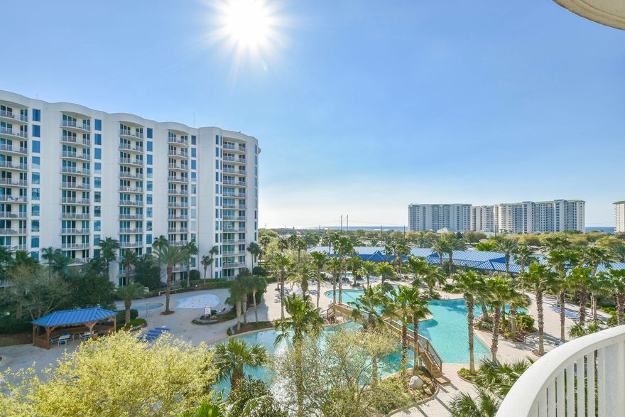 This 5th floor, junior two-bedroom condo offers views overlooking the pool area. It has an open concept living and dining area, as well as an expansive and inviting balcony just perfect for taking in the serenity of the pool. Enjoy the many onsite amenities, including a lushly landscaped pool area boasting Destin's largest lagoon pool with waterfall features, a kiddie pool, hot tub, and splash pad, as well as a playground, fitness center, and tennis and basketball courts. Want your toes in the sand? The resort offers complimentary shuttle service to the beach for you to enjoy Destin's world famous sugar-white sand and emerald-colored water beaches. Shuttle service takes you to the June White Decker Public Beach access which is just minutes away.