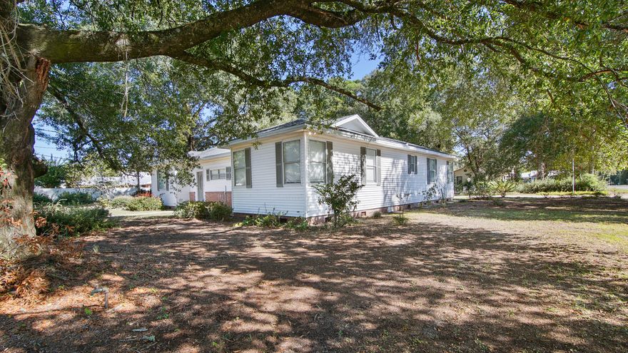 Spacious and full of character, this 1950 home with 3000+ SF, sits in the heart of the Historic District just steps from Lake DeFuniak and a short stroll to downtown shops, dining and events. Generous rooms with 9' ceilings, hardwood floors, with updates including new roof, fresh paint and a kitchen refresh while preserving the mid-century charm of the 3 baths. Three bedrooms plus a huge 4th bed/den also works beautifully as guest suite or studio. Enclosed front and back porches create bonus flex spaces for sunroom, office, playroom, etc. Situated on a corner lot over 1/3 acre with space for a pool, garden and outdoor fun. Detached 2-car garage adds possibilities with office/storage space plus a window unit and plumbing. A rare find in the walkable center of downtown DeFuniak Springs.