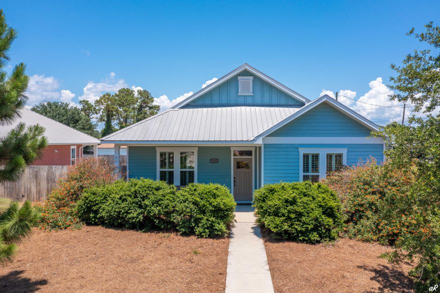 This 2015 beautifully built craftsman style home is located in the highly desired area of south lagoon on PCB's East End. As you enter this split floorpan home, find 9' ceilings with crown molding, hand scraped wood floors and 3' wide doors. Plantation shutters allow for abundant natural light to pour into the living space and kitchen. In the kitchen, you will find granite countertops, Frigidaire stainless steel appliances and double French doors that open up to a covered porch in your fenced in backyard. A single car garage is attached to stow your beach toys, car or golf cart. Hurricane panels and a metal roof offer for great protection during storm season. Just around the corner is the Dolphin boat ramp.