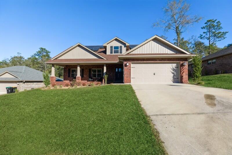 Come view this massive 2,624 sq. ft. beauty with 5 bedrooms (plus bonus room) / 3 bathrooms within the Nanterre Community, located in north-west Crestview. Your new home is only three years old with the original roof, A/C, and water heater. The roof has architectural shingles with solar panels, seller to pay for half at closing. As you enter the house, you'll be greeted with a split floor plan (4 bedrooms to include the master) and the 5th bedroom with bonus room on the second floor. Perfect for an office or game room. The master includes dual vanity sinks, split shower/tub, with large walk-in closet. The kitchen has granite counter tops with GE appliances that convey. The backyard is massive with room for your future pool. This home is a must see in this beautiful community!
