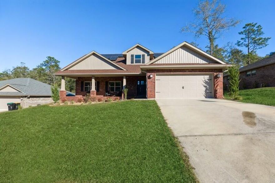 Come view this massive 2,624 sq. ft. beauty with 5 bedrooms (plus bonus room) / 3 bathrooms within the Nanterre Community, located in north-west Crestview. Your new home is only three years old with the original roof, A/C, and water heater. The roof has architectural shingles with solar panels, seller to pay for half at closing. As you enter the house, you'll be greeted with a split floor plan (4 bedrooms to include the master) and the 5th bedroom with bonus room on the second floor. Perfect for an office or game room. The master includes dual vanity sinks, split shower/tub, with large walk-in closet. The kitchen has granite counter tops with GE appliances that convey. The backyard is massive with room for your future pool. This home is a must see in this beautiful community!