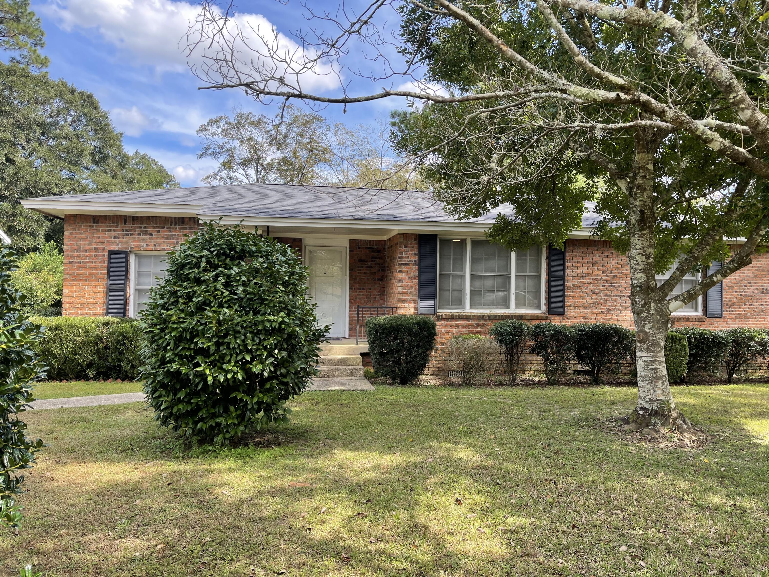 Adorable 2 bedroom and 2 bath home with 1405 sq ft centrally located in Crestview close to shopping, schools, and restaurants! This home has hard wood floors, but the seller is offering a flooring credit of $2000! The roof and heating and air condition system was replaced in 2017 approximately. The hot water heater is not very old! This is an all brick home with a large two car carport! In addition there is a separate detached laundry room with extra storage space! Buyer to verify all dimensions and information.