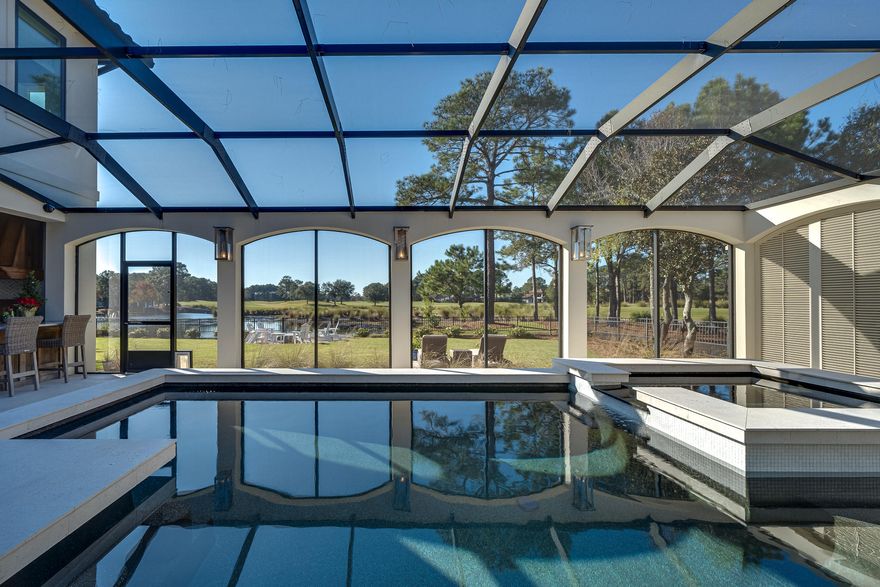 Simply stunning, better than new, amazing custom residence perfectly situated in one of the area's favorite neighborhoods, featuring some of the best views that money can buy.  Absolutely no expense has been spared on this beautiful estate home which has been completely remodeled with the finest finishes available to the trade and highest quality workmanship and construction.  Attention to detail on the inside and out, this new offering is a must see.  Expansive views of the golf course and the lake, with screened lanai featuring outdoor kitchen, outdoor bath, pool and hot tub promoting year around enjoyment of our wonderful climate and ample room for entertaining family and guests.  While there are too many features to list, in addition to the entire interior remodel,just a few highlights