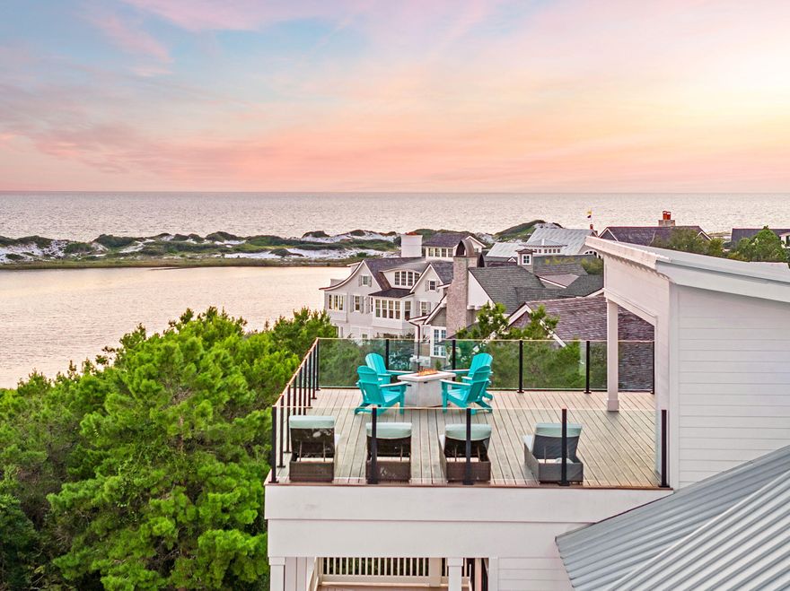 Distinguished by breathtaking Gulf & Coastal Dune Lake views, 'Camp Creek Villa' is a luxurious coastal retreat featuring 8 bedrooms and nine bathrooms, accommodating up to twenty-four guests, located by Camp Creek Lake on 30A. Enjoy the beauty of the charming courtyard, complete with a private pool and covered patio. With beach access just a short stroll away and The Big Chill on 30A less than a mile from your doorstep, this is the perfect vacation retreat. Illustrating the beauty of the Gulf Coast, 'Camp Creek Villa' perfectly combines indoor and outdoor living with a spacious three-story layout and expansive backyard. Upon entering, the first-floor game room complete with a ping pong table, entertainment area & wet bar evokes a playful competitive spirit. Cheer on your favorite team on the oversized couch while sipping & snacking. Down the hall is a bunk room with three twin-over-twin beds perfect for the kids to game out or scroll. A shared bathroom and laundry room are also located on the first floor. The sliding glass doors provide direct access to the lush turf, private pool, outdoor shower, and natural gas grilling station. Unwind on the loungers or daybed while listening to the cascading waterfall in the pool.

Step into luxury with an in-home elevator that leads to the second-floor great room, complete with a wall of windows that frame nearly 360-degree views of the Gulf and a rare Coastal Dune Lake. The coffered ceilings, shiplap walls, and wood floors add a touch of elegance as loved ones relax on the two matching sofas in the living area. Guests can assist with meal prep at the five-stool breakfast bar and gather around the eight-seat dining table for a home-cooked meal or catered dining experience. The dining area provides access to a covered balcony, perfect for sunrises with coffee or a smoothie. With side-by-side commercial refrigerators and a four-burner stove, the gourmet kitchen is fully equipped for the talented home chef.

Before retiring for the evening to the two guest bedrooms off the great room, continue your favorite book in the reading nook near the stairs. The third floor was thoughtfully designed for the seasoned traveler consisting of an outdoor balcony with porch swing, as well as a bonus room, complete with a TV, wet bar, couch, armchairs, and game table. The primary bedroom is a five-star resort within itself with a private balcony, king size bed and a spa-like ensuite bathroom with double vanities and a soaking tub enclosed in a walk-in shower. Also on the third floor is another bunk room with two twin-over-twin beds and shared bathrooms. Two additional guest bedrooms are both equipped with queen beds and ensuite bathrooms, one only accessible through the bunk room. This floor also has a laundry room with a full-size washer and dryer. Above the third floor is an amazing viewing deck. 'Camp Creek Villa' offers a quintessential beachfront experience with the finest luxury amenities. With on-site parking for six vehicles, including two in the garage, this is ideal for exploring the other scenic 30A communities.


RESTAURANTS NEARBY
" The Big Chill - Variety of Restaurants/Family Friendly
" Pizza By The Sea (Casual)
" La Co Latin Coastal (Casual)
" Reel 'Em In (Seafood Market)
" Amavida (Coffee)
" The Citizen (Fine Dining)
" Old Florida Fish House (Casual)
" Cowgirl Kitchen (Casual)
" La Crema (Tapas)
" Pescado (Fine Dining/No Kids)
" Paradise (Fine Dining)
" Summer Kitchen (Casual)
" Charlie's Cafe (Coffee & Donuts)
" Edwards (Fine Dining)
" Seacrest Sundries (Grocery/Grab & Go)

HOME HIGHLIGHTS:
- Gulf & Coastal Dune Lake views throughout the home
- Private pool 
- Elevator
- Rooftop Terrace
- 2 Game Rooms
- 6 Adult Bikes Included
- Two 6 Seater Golf Carts Included
- Beach Accesses: Gulf Lakes Public Beach Access & Deer Lake State Park


SLEEPING ARRANGEMENTS (Sleeps 24):

FIRST FLOOR:
- Guest Bedroom 1: Three Twin over-Twin Bunk Beds (sleeps 6) Shared Hallway Bathroom with Single Vanity & Shower/Tub Combo

SECOND FLOOR:
- Guest Bedroom 2: Queen Bed (sleeps 2) & Ensuite Bathroom with Single Vanity & Shower/Tub Combo
- Guest Bedroom 3: King Bed (sleeps 2) & Ensuite Bathroom with Double Vanity & Shower
- Guest Bedroom 4: Two Twin over Twin Bunks with Shared Bathroom with Single Vanity & Tub/Shower Combo

THIRD FLOOR:
- Primary Bedroom 5: King Bed (sleeps 2) & Ensuite Bathroom with Double Vanities & Soaking Tub Enclosed in Walk in Shower
- Guest Bedroom 6: King Bed (sleeps 2) & Ensuite Bathroom with Single Vanity & Shower/Tub Combo
- Guest Bedroom 7: Queen Bed (sleeps 2) & Ensuite Bathroom with Single Vanity & Shower
- Guest Room 8: Bunk Room with Two Twin Over Twin Beds with Shared Bathroom with Double Vanities and Tub/Shower Combo