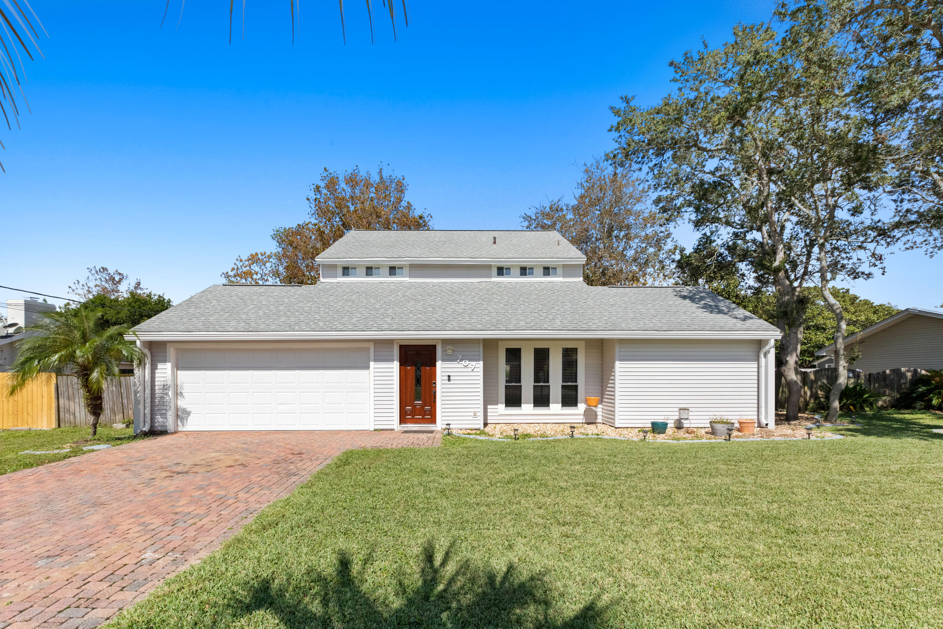 Welcome to 707 Swan Lane the best priced 4BD, 2.5BA home in the heart of Destin. This home features recessed lighting, granite counter tops, LVP flooring, stainless steel appliances and so much more. Working from home? The 4th bedroom downstairs can also be used as a home office or home gym with a separate heating and cooling unit to keep it extra cold. When hosting friends and family you will love the large eat in kitchen that opens up to an oversized family room. The huge open back yard is perfect for enjoying the summer with a fully fenced in yard that will give you plenty of privacy. With NO HOA you can store your boat or RV in the side yard and not pay for storage fees! Mature landscaping with plenty of room for a pool will keep you loving this home for many years to come.