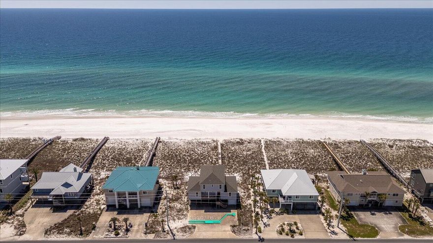 Fantastic opportunity to acquire a turn-key income producing beach home! Lowest price per foot Gulf front home on Navarre Beach! Experience Gulf front living in this Navarre Beach cottage with a front row seat to one of Florida's most beautiful beaches. Featuring 6 bedrooms and 5 baths, this cottage offers ample space for relaxation and entertainment. With two separate generous living rooms, there is plenty of room for gatherings, whether it's a family reunion, wedding party or a group of friends. The upper living room, outfitted with cozy bunks, a full bath and a gorgeous view, provides a charming space for guests, ensuring everyone feels comfortable privacy in their space. Immerse yourself in the beauty of beachfront living as you soak in the unparalleled views of the Gulf of Mexico. This property has served as a cherished family retreat for many years, providing countless memories of laughter and joy.

Beyond its role as a private retreat, this cottage has also proven to be a lucrative investment as a successful rental, offering a fantastic opportunity for those seeking both leisure and financial gain.

Indulge in the coastal lifestyle you've always dreamed of here. Whether you're seeking a personal haven or an income-generating asset, this residence promises a lifetime of cherished moments and endless possibilities.
