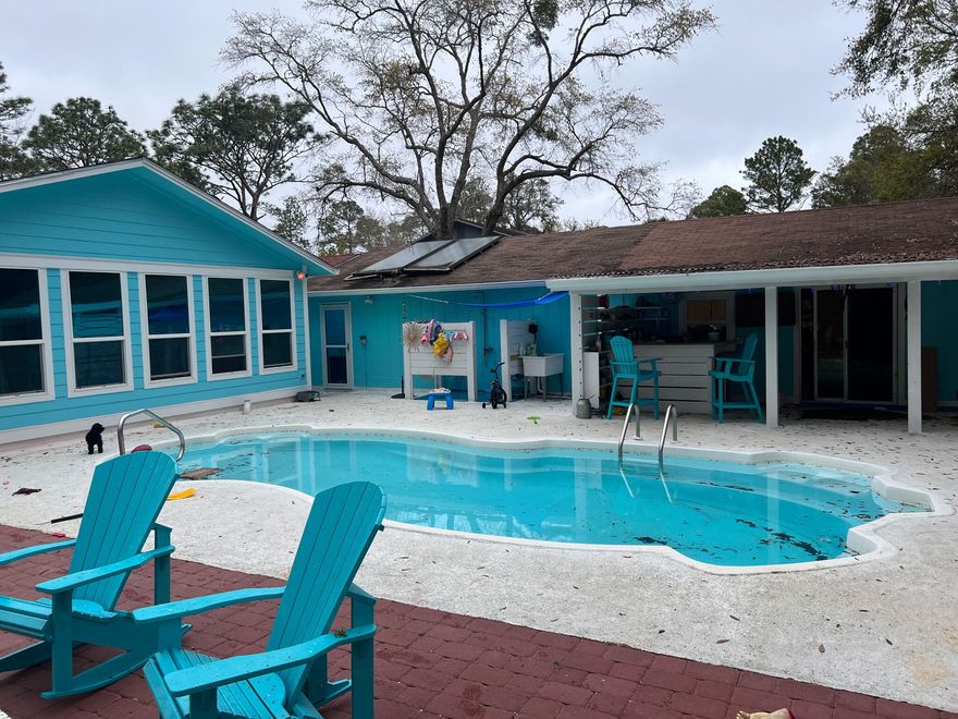 INVESTOR OPPORTUNITY IN THE HEART OF SANTA ROSA BEACH!! Put your own  touches on this fixer-upper and watch your bottom line GROW! The spacious property features 2 separate cottages situated on .34 acres - the main house offers 4BR/2.5BA, and the guest house offers 3BR/2BA, perfect for a mother in law suite, or steady rental income! Close to schools, popular restaurants, and just a 5 minute drive to Hogtown Bayou public boat launch! Plenty of room to park your RV AND boat on your property! Private in-ground pool! Whether for your homestead, your second home, an investment or an AirBnB, this property checks all the boxes! Call today to tour this property and find out what you need to do to bring this one of a kind property back to life.