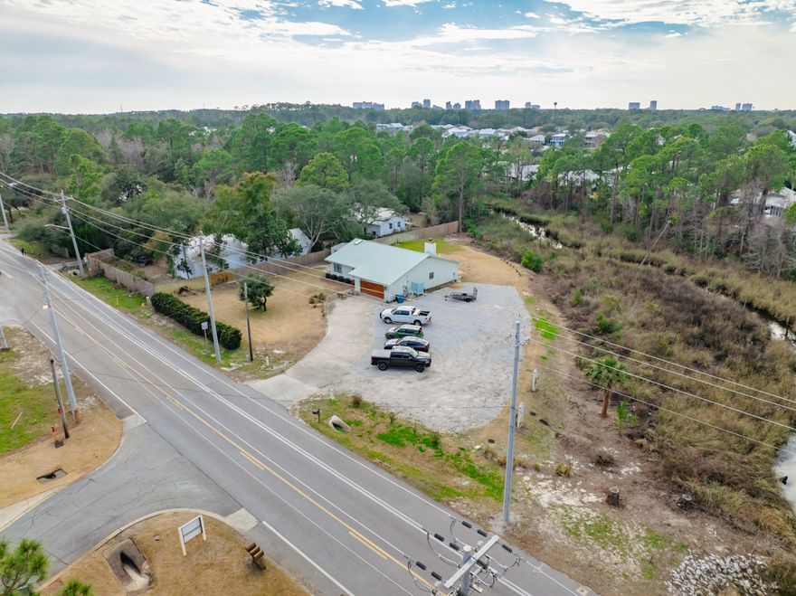 This 1.24 acre lot is ideally located on Mack Bayou in the heart of Santa Rosa Beach near Miramar Beach. While it is home to a single family residence, it is zoned by Walton County as Coastal Center. This zoning designation allows an array of commercial businesses including restaurant and retail. The home could be converted into a small business or removed in order to build a new commercial business. The area is in close proximity to a myriad of various businesses. The parcel is also listed in residential.