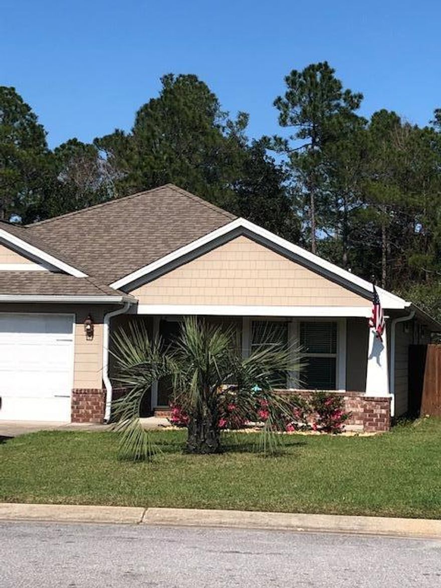 Sweet craftsman style home, located in east Navarre, with all the upgrades. Popular open floor plan with updated colors, tile floors through out the public areas of the home. Kitchen offers upgraded stainless steel appliances, granite counter tops, breakfast bar, custom cabinets, tiled back-splash, extra large walk in pantry. Formal dining area. Spacious Living Room with vaulted ceiling, and fan. Double sinks in both Master and Hall bathrooms. Master Bedroom is at the back of the house and over looks the conservation easement, giving you extra privacy. Split floor plan, with the additional bedrooms at the the front of the house. Fully fenced back yard, and a lovely covered patio, perfect for entertaining. House has hardy board for siding, Hurricane protection, sprinkler system.