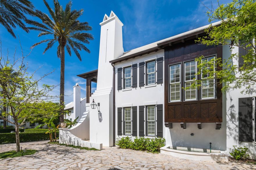 This thoughtfully designed 4 bedroom, 3 -1/2 bath courtyard home is located on a stone pedestrian path and overlooks one of Alys Beach's many green parks. A spacious 3,456 square foot home is situated to capture light and breezes from the outdoor living areas, offering a courtyard and loggia. The kitchen boasts limestone countertops, glass tile backsplash, custom cabinetry, 6 burner Thermador gas range oven, and a banquette breakfast nook. A dining room and living room with fireplace flow from the kitchen, making this area a special gathering place. Peacock pavers have been used throughout the first floor. The palette is neutral, peaceful, and enhanced by elegant trim work, arches and venetian plaster. Stunning Australian cypress flooring is used throughout the second floor. The serene master suite with fireplace is located on the second level. The venetian marble countertops in the master bath compliment the glass tile and set the tone for this elegant bath. A private balcony overlooks the beautifully landscaped park and outdoor fire pit to the Gulf. A popular first floor secondary master bedroom, decorated with glass tile and marble bath, is tucked off the private courtyard. The third and fourth bedrooms are located off a private staircase and share a spacious bath with one having a private balcony.  